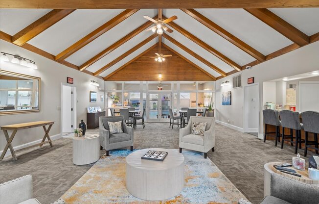 a living room with couches and chairs and a table