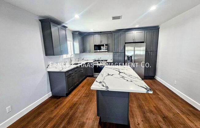 1551 W 103 ST