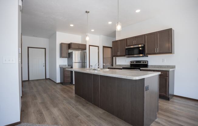 a kitchen with a large island in the middle