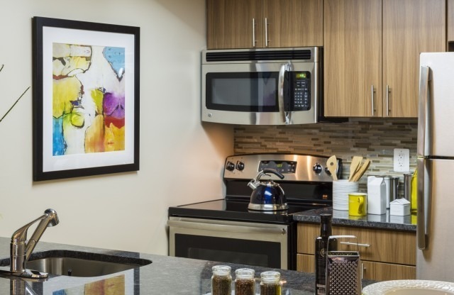 Renovated Apartments With Granite Countertops, Wood-Style Flooring and Stainless Steel Appliances