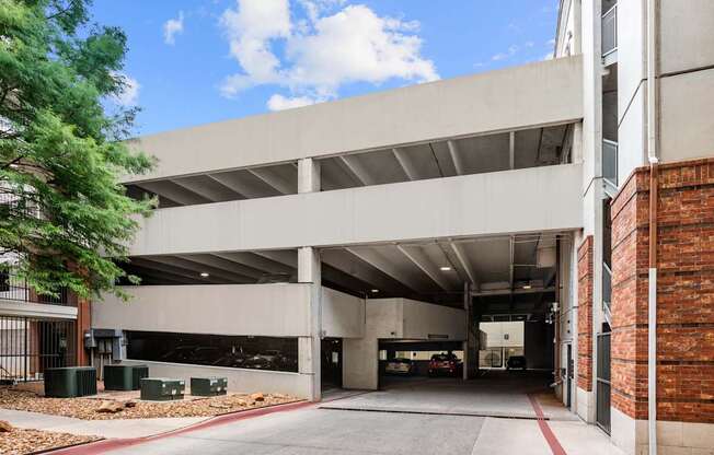 A parking garage with a clear blue sky in the background.