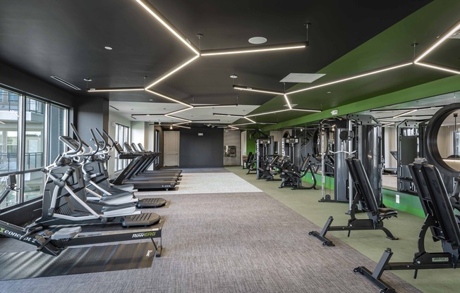 Enhance your workout routine at Modera Garden Oaks' HIIT-inspired fitness studio, featuring TRX stations and state-of-the-art Echelon Fitness Smart Mirror pods for a dynamic exercise experience.