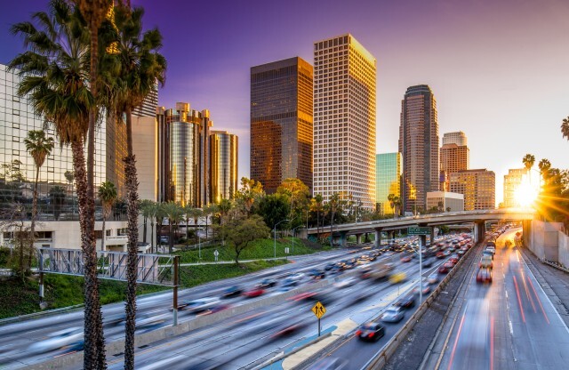 Los Angeles Freeway with Sunset and High Rise Buildings