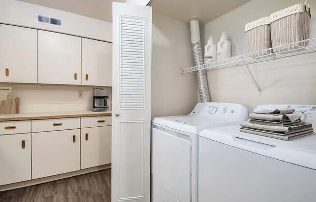 A kitchen with a washer and dryer at The Highlands Apartments, Indiana