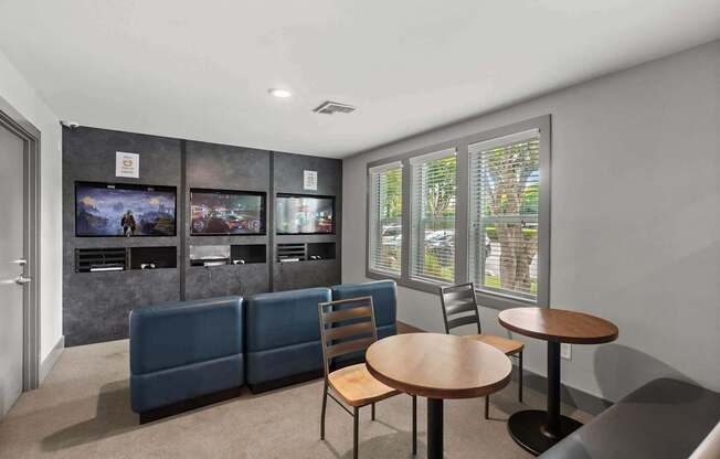 A living room with a couch, chairs, and a television. at Northpoint Apartments, Tacoma, WA, 98407