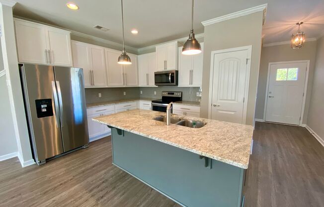 3 bed/2.5 bath at end unit townhome in Berkeley Walk at Savannah Quarters with garage