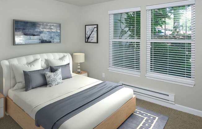 A bedroom with a large bed and a painting on the wall.