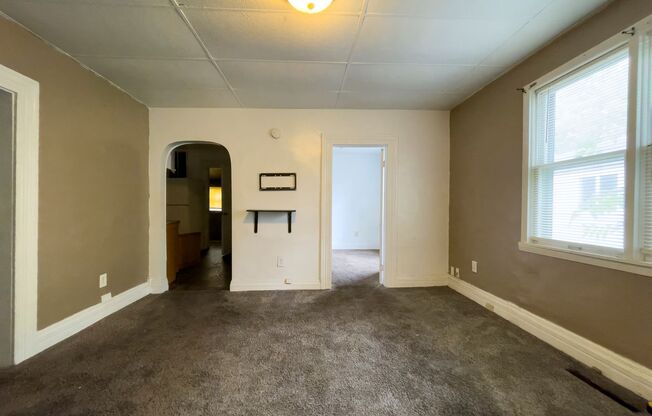 Fall into this cozy 3-Bedroom Home with a fenced in yard & detached garage!