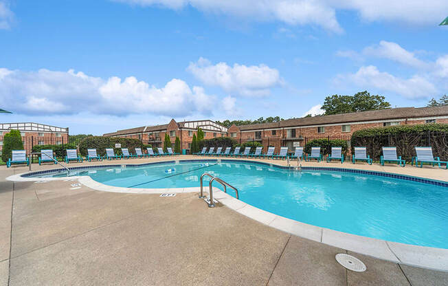 Community Swimming Pool with Pool Furniture at Heights Marlborough Apartments in Boston, MA.