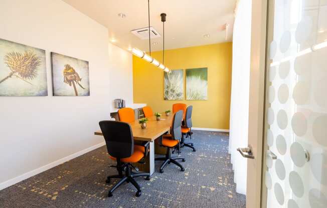 a conference room with a long table and chairs