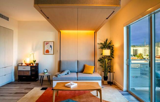 a living room with a couch and a table