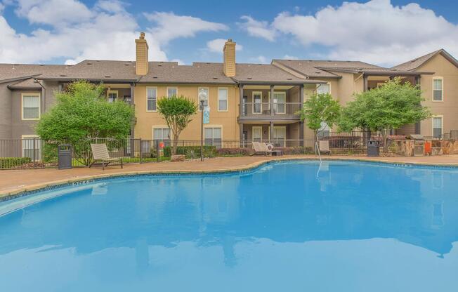 a large pool of water in front of a house