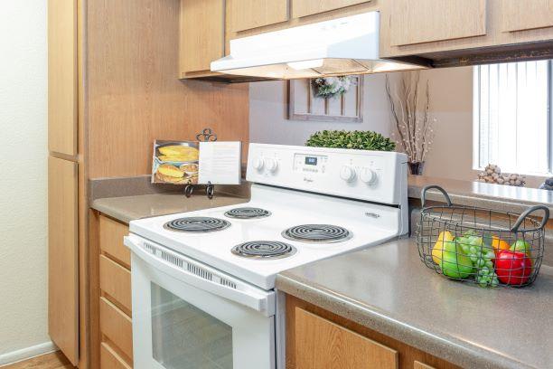 Electric Range In Kitchen at Ranchwood Apartments, Glendale, 85301