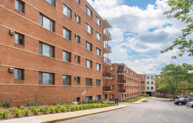 a large brick building with a street in front of it