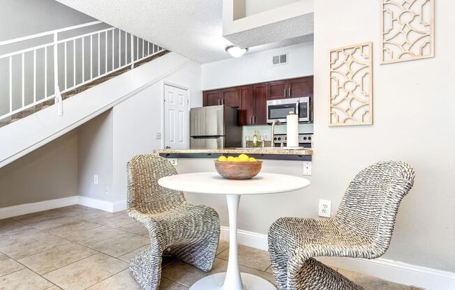 a living room with two chairs and a table at Waterford Park Apartment Homes, LLC, Florida, 33319