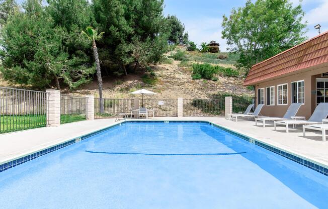 a pool next to a fence