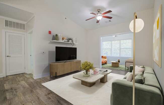 a living room with a couch and a tv