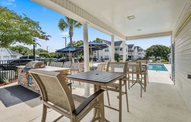 A patio with a table and chairs is shown.