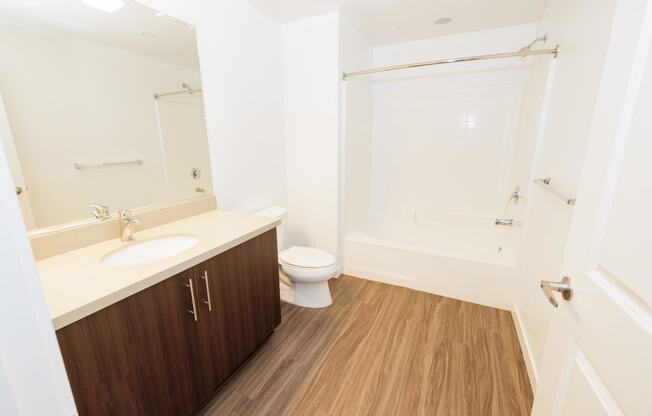 a small bathroom with a sink toilet and shower