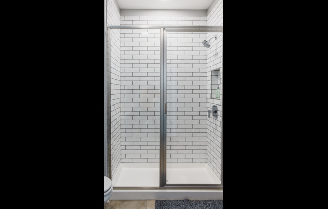 Oversized showers with glass surrounds and rain shower heads