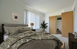 Bedroom With Closet at Charter Oaks Apartments, Michigan