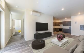 a living room filled with furniture and a flat screen tv