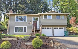 Split-Level Stunner with Skylight, Hardwoods & Room to Grow
