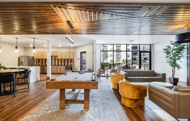 a living room filled with furniture and a table