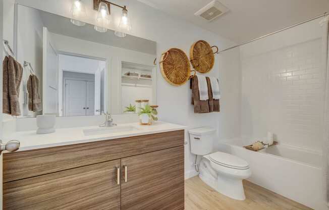 a bathroom with a toilet sink and bathtub