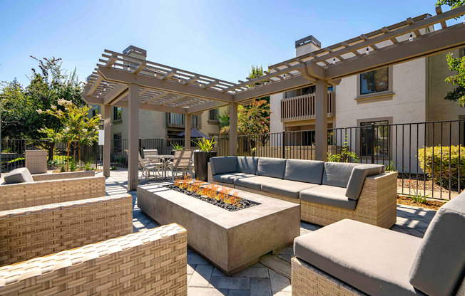 Apartments for Rent Walnut Creek - Park Lake at Walnut Creek - Relaxing Fire Pit with Cozy Seating, Tables and Chairs, and Highly Designed Pergola