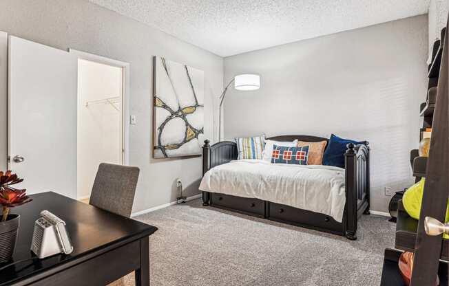 Stylishly furnished model bedroom at Laurels of Sendera apartments in Arlington, TX