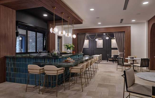 A modern kitchen with a bar area and dining area.