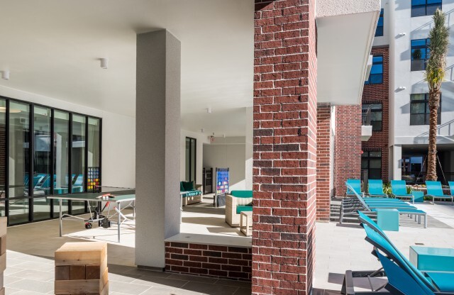 Outdoor Portico Games & Pool Seating | Tinsley on the Park | Apartments In Houston