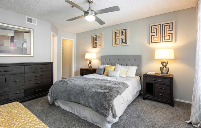 the preserve at ballantyne commons bedroom with bed and ceiling fan