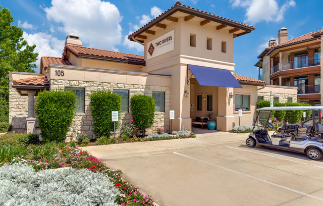 a golf cart parked in front of a hotel building