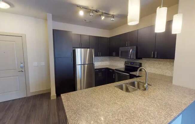 Kitchen With Custom Maple Cabinetry at Civic at Frisco Square Apartments, Frisco, 75034