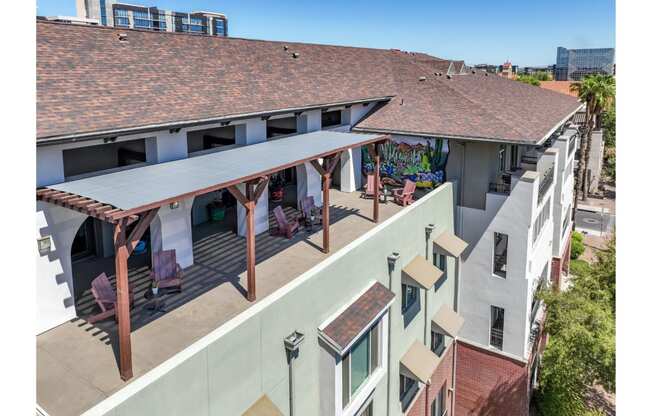 outdoor patio with covered lounging areas at Roosevelt Square apartments