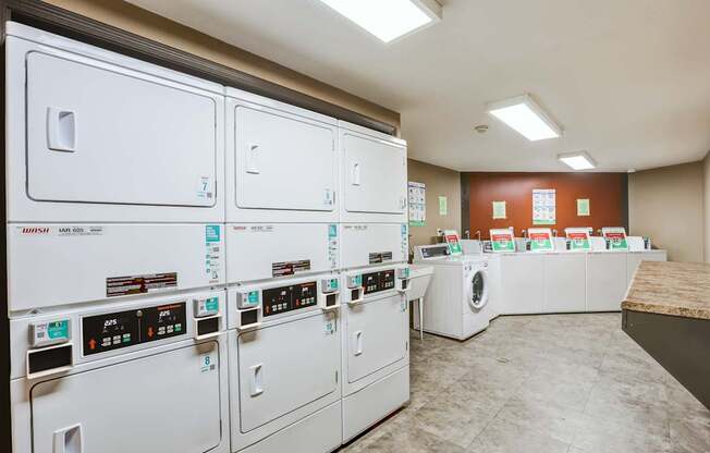 A row of washing machines in a laundromat.
