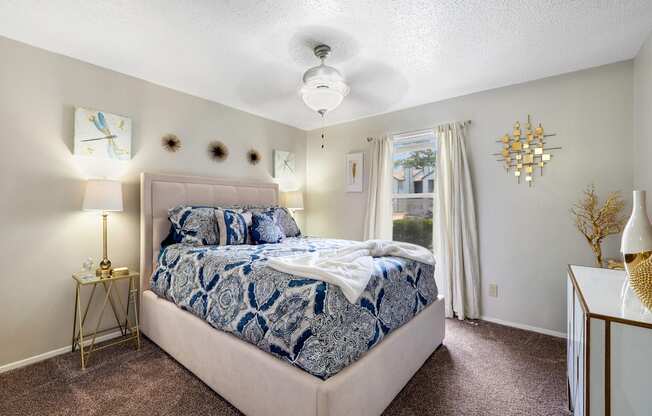 a bedroom with a bed and a window