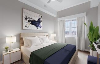 a bedroom with a bed and a ceiling fan