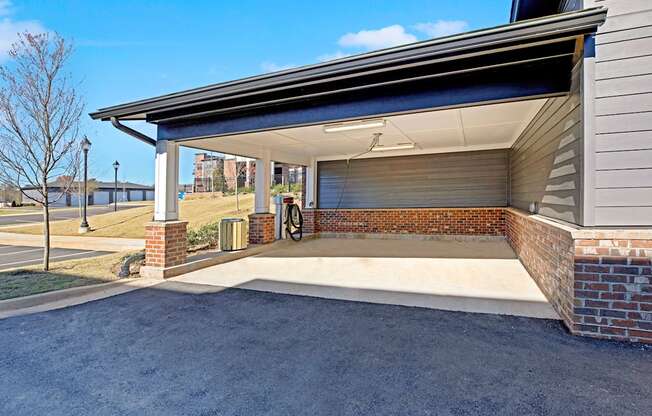 the garage of a home with a covered porch