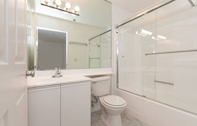 Bathroom with White Cabinets and Bathtub/Shower