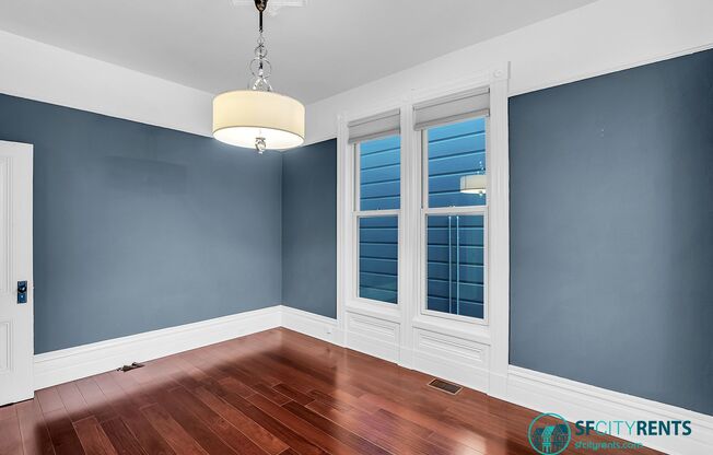 Lower Pacific Heights: Victorian Condo w/ Double Parlor, Shared Yard & EV-Ready Garage Parking