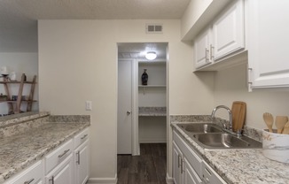 This is a photo of the kitchen in the 472 square foot 1 bedroom, 1 bath apartment at Princeton Court Apartments in the Vickery Meadow neighborhood of Dallas, Texas.