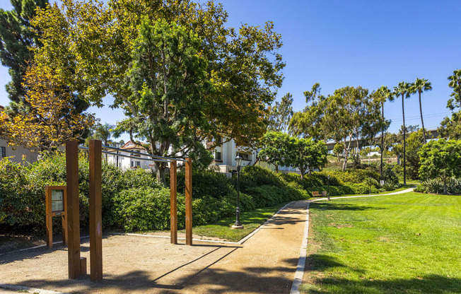 a path leading to a park with trees and grass at La Jolla Blue, California