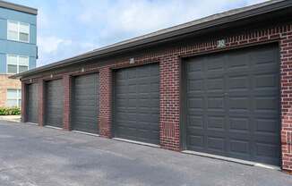 A row of black garage doors are closed.