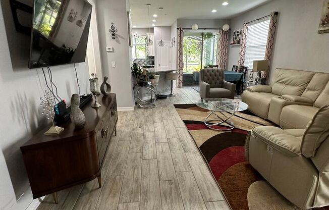 Lease this 3BR End-Unit Townhome in Gated Community with Water View!