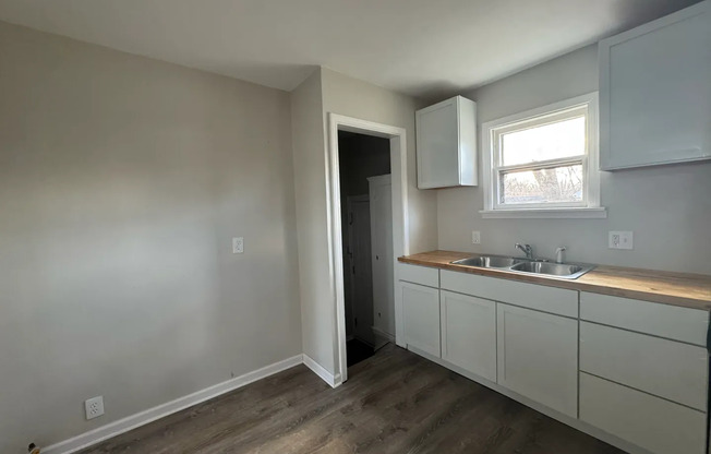 2 bed 1 bath recently refinished corner home with new kitchen, bathroom, and floors!