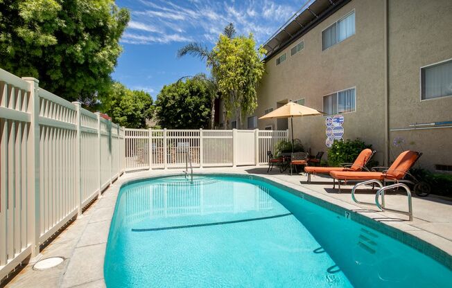 Apartments for Rent in West Hills, CA - Topanga - Pool with Lounge Chairs and Fence.