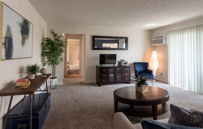 This is a picture of the living room in the 850 square foot, 1 bedroom, 1 bath apartment at Fairfield Pointe Apartments in Fairfield, Ohio.